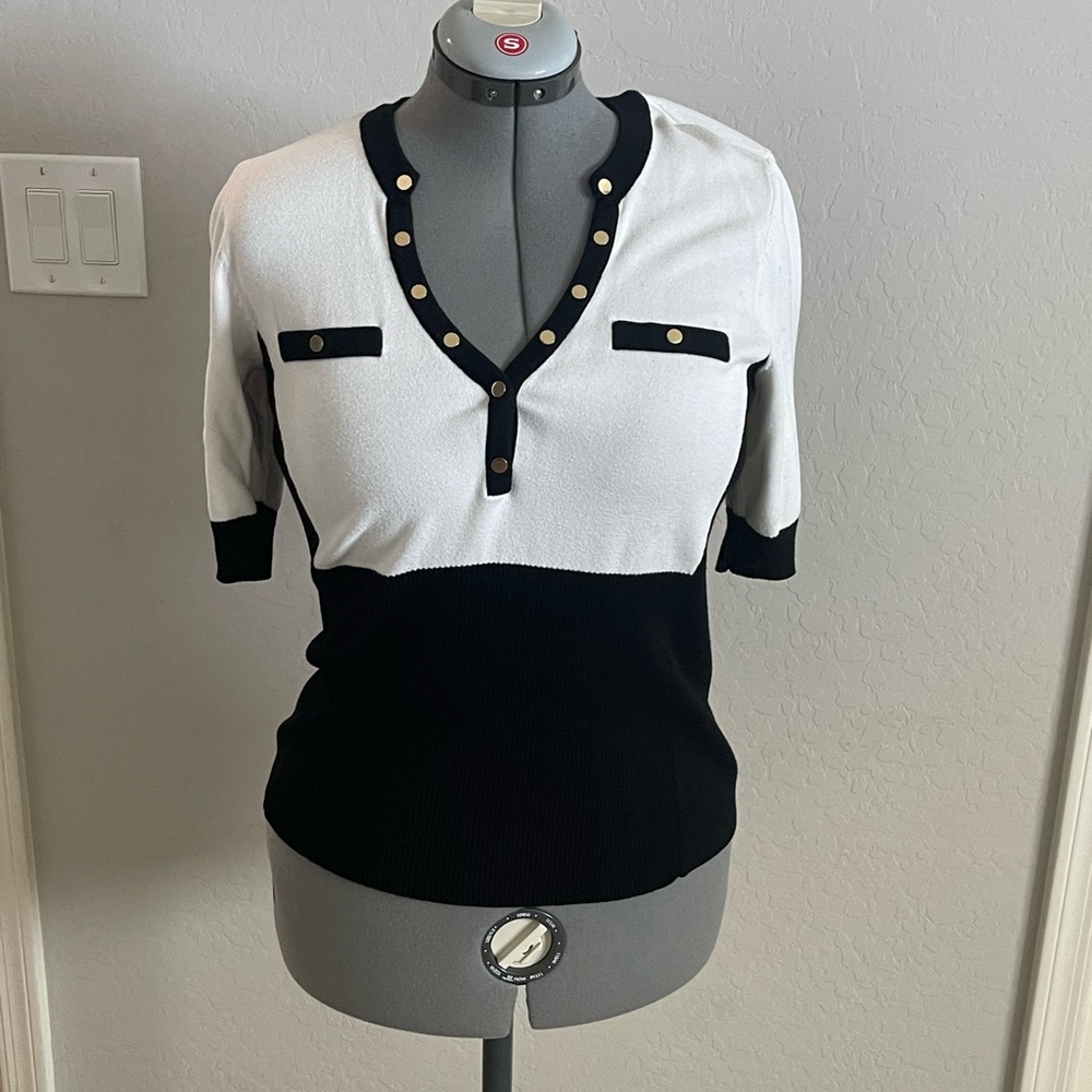 Black and White V-Neck Sweater with Gold Accents